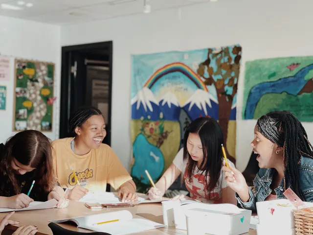 A study circle of friends gathered around a table, studying together