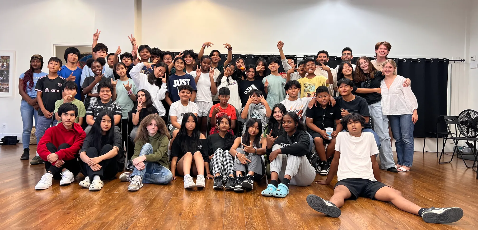 A large group of youth gathered together indoors